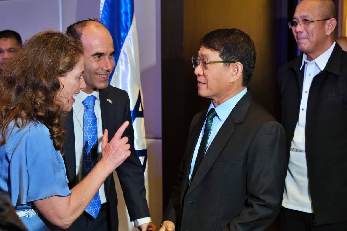Ambassador Fluss (second from left) and wife Gila greet arriving guest, National Security Adviser Eduardo Año.